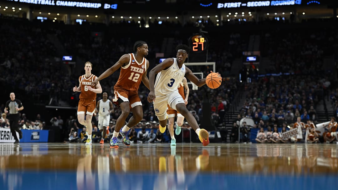Mar 19, 2026; Portland, OR, USA; BYU Cougars forward AJ Dybantsa (3) drives against Texas Longhorns guard Tramon Mark (12) in the second half during a first round game of the men's 2026 NCAA Tournament at Moda Center. Mandatory Credit: Troy Wayrynen-Imagn Images