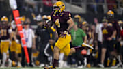 Arizona State Sun Devils running back Cam Skattebo (4) runs with the ball against the Iowa State Cyclones during the first half at AT&T Stadium.