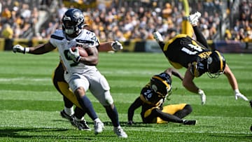 Seattle Seahawks running back Kenneth Walker III scores a touchdown in front of Pittsburgh Steelers defenders Brandin Echols and Payton Wilson during the second half at Acrisure Stadium.
