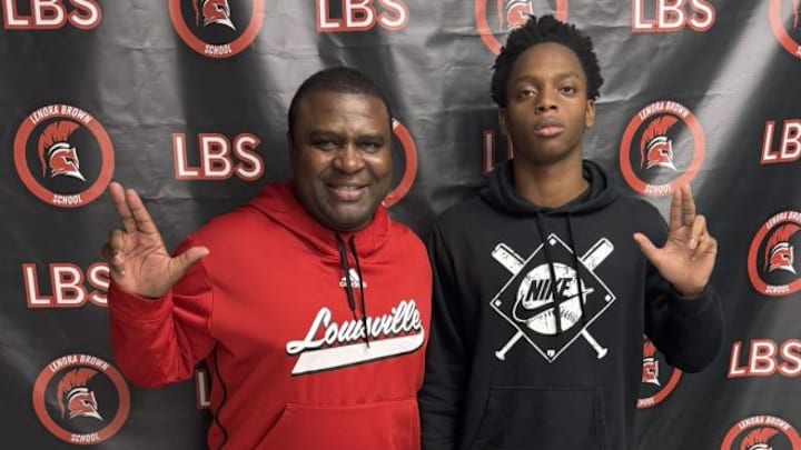 RJ Jones with Louisville CB coach Steve Ellis.