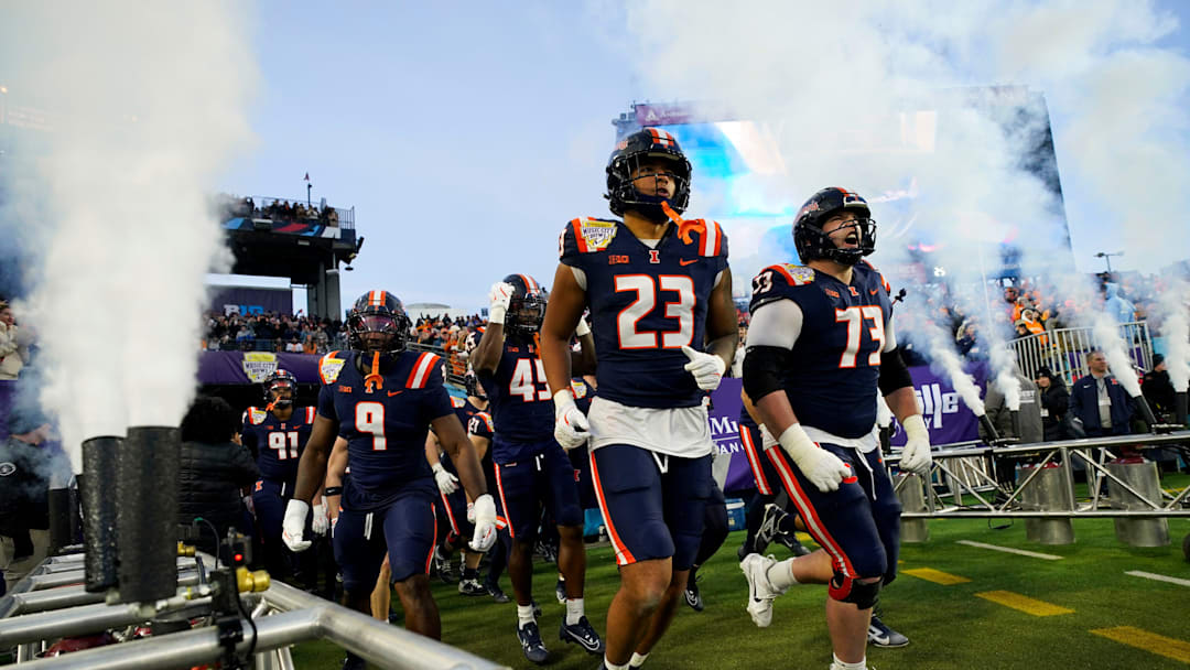 Illinois players take the field for the Music City Bowl against Tennessee for an NCAA football game on Dec. 30, 2025, in Nashville, Tennessee.