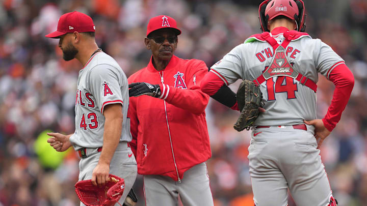 Mar 28, 2024; Baltimore, Maryland, USA; Los Angeles Angels manager Ron Washington (center) removes pitcher Patrick Sandoval (left) in the second inning against the Baltimore Orioles at Oriole Park at Camden Yards. Mandatory Credit: Mitch Stringer-USA TODAY Sports