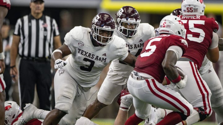 Sep 30, 2023; Arlington, Texas, USA; Texas A&M Aggies defensive lineman McKinnley Jackson (3) and Arkansas Razorbacks running back Raheim Sanders (5) in action during the game between the Texas A&M Aggies and the Arkansas Razorbacks at AT&T Stadium. Mandatory Credit: Jerome Miron-USA TODAY Sports