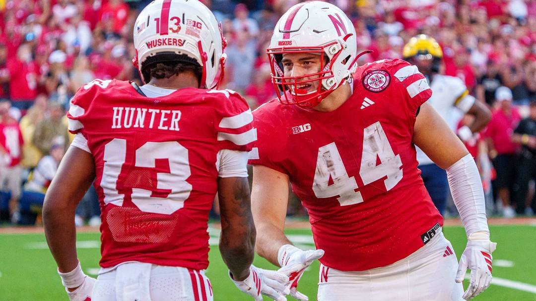 Sep 20, 2025; Lincoln, Nebraska, USA; Nebraska Cornhuskers tight end Luke Lindenmeyer (44) and wide receiver Nyziah Hunter (13) celebrate after a call against the Michigan Wolverines during the fourth quarter at Memorial Stadium. Mandatory Credit: Dylan Widger-Imagn Images