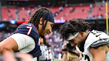 Oct 15, 2023; Houston, Texas, USA; Houston Texans quarterback C.J. Stroud (7) and New Orleans Saints wide receiver Chris Olave (12) exchange jerseys after the game at NRG Stadium. Mandatory Credit: Maria Lysaker-Imagn Images