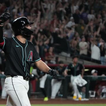 Aug 9, 2024; Phoenix, Arizona, USA; Arizona Diamondbacks catcher Adrian Del Castillo (25) hits a walk off solo home run against the Philadelphia Phillies in the ninth inning at Chase Field. Mandatory Credit: Rick Scuteri-USA TODAY Sports