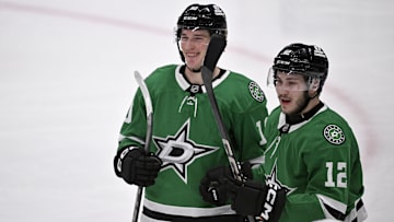 Jan 4, 2025; Dallas, Texas, USA; Dallas Stars center Oskar Back (10) and right wing Arttu Hyry (12) celebrates a goal scored by Back against the Utah Hockey Club during the second period at the American Airlines Center. Mandatory Credit: Jerome Miron-Imagn Images