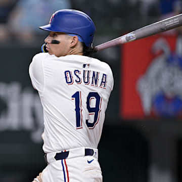 Jul 2, 2025; Arlington, Texas, USA; Texas Rangers left fielder Alejandro Osuna (19) bats during the game between the Texas Rangers and the Baltimore Orioles at Globe Life Field.