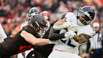 Cleveland Browns linebacker Carson Schwesinger, left, tackles Tennessee Titans running back Tony Pollard 