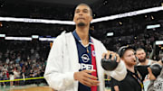 Apr 13, 2025; San Antonio, Texas, USA; San Antonio Spurs center Victor Wembanyama (1) prepares to throw a ball in to the stands in celebration of Fan Appreciation Day after a victory over the Toronto Raptors at Frost Bank Center.