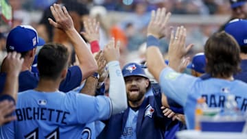Jul 26, 2025; Detroit, Michigan, USA;  Toronto Blue Jays outfielder Nathan Lukes (38) receives congratulations from teammates after he hits a home run in the ninth inning against the Detroit Tigers at Comerica Park. Mandatory Credit: Rick Osentoski-Imagn Images