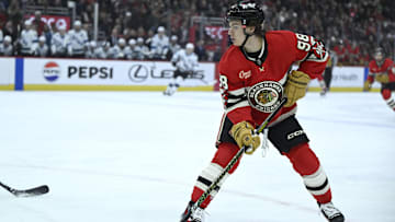 Mar 7, 2025; Chicago, Illinois, USA;  Chicago Blackhawks center Connor Bedard (98) moves the puck against the Utah Hockey Club during the first period at the United Center. Mandatory Credit: Matt Marton-Imagn Images