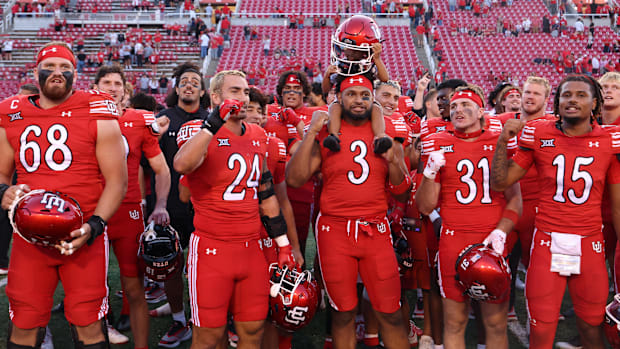 The Utah Utes celebrate a win over the Cal Poly Mustangs 
