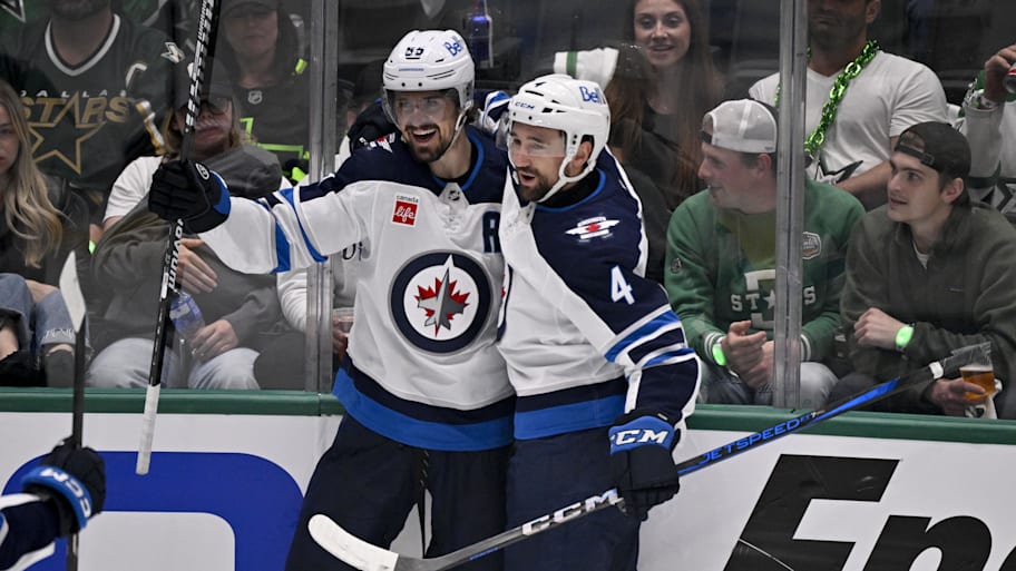 Winnipeg Jets center Scheifele and defenseman Pionk celebrate a goal scored by Scheifele against the Dallas Stars in game six of the second round of the 2025 Stanley Cup Playoffs at American Airlines Center.  | Jerome Miron-Imagn Images