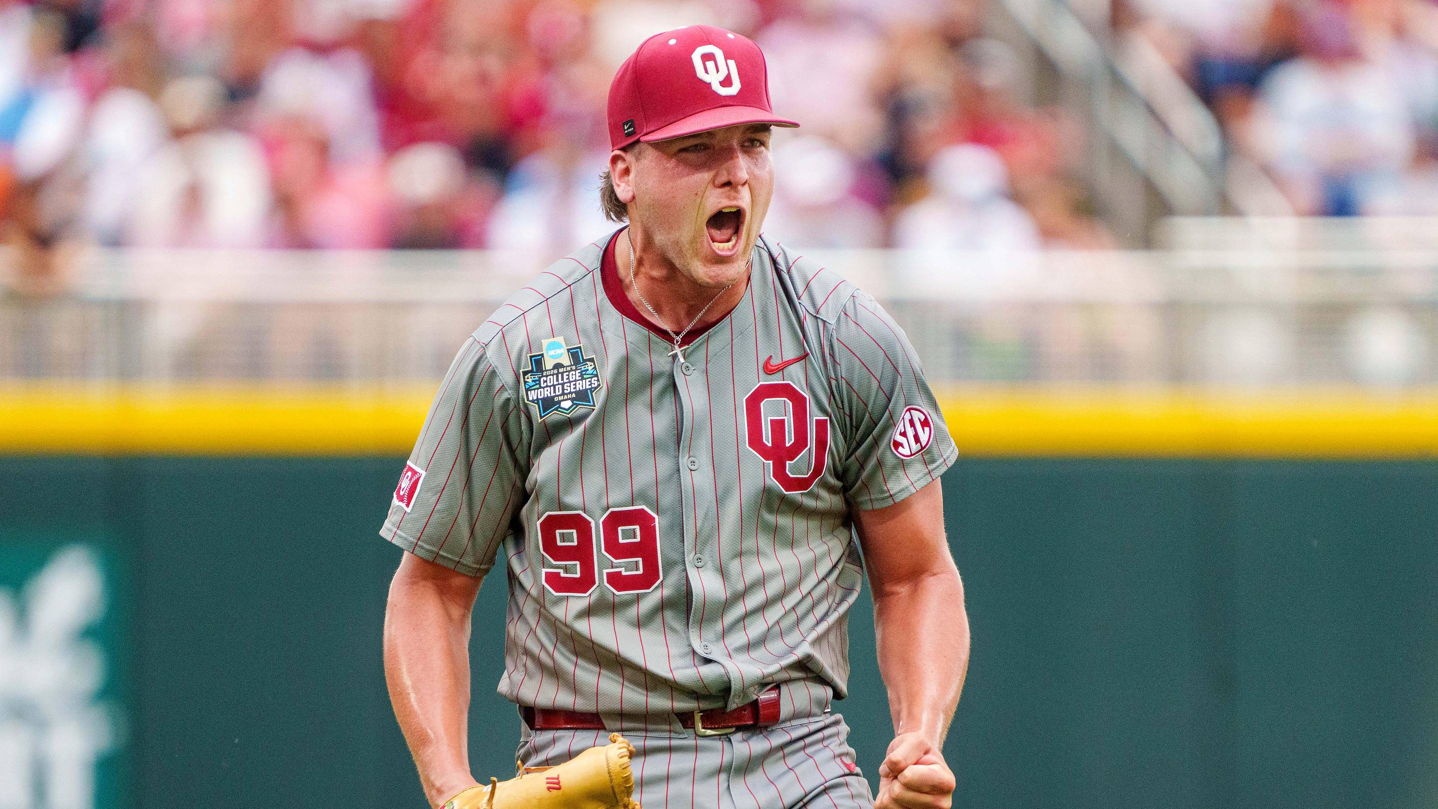 Jun 13, 2026; Omaha, NE, USA; Oklahoma Sooners starting pitcher Cord Rager (99) celebrates while walking off at the end of the seventh inning against the Alabama Crimson Tide at Charles Schwab Field. Mandatory Credit: Dylan Widger-Imagn Images