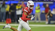 UNLV Rebels wide receiver Kayden McGee (16) completes a pass play as he runs for a touchdown in the first half against the California Golden Bears at SoFi Stadium. Mandatory Credit: Jayne Kamin-Oncea-Imagn Images