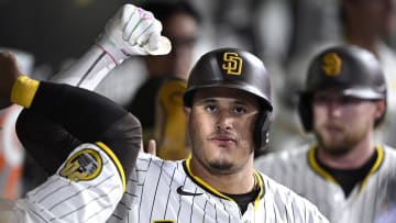 Aug 20, 2024; San Diego, California, USA; San Diego Padres third baseman Manny Machado (13) is congratulated in the dugout after hitting a two-run home run against the Minnesota Twins during the seventh inning at Petco Park. Mandatory Credit: Orlando Ramirez-USA TODAY Sports