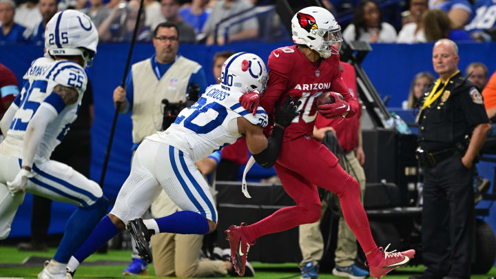 Aug 17, 2024; Indianapolis, Indiana, USA; Arizona Cardinals wide receiver Chris Moore (10) is pushed out of bounds by Indianapolis Colts safety Nick Cross (20) during the second quarter at Lucas Oil Stadium. Mandatory Credit: Marc Lebryk-USA TODAY Sports