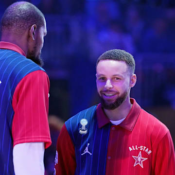 Feb 18, 2024; Indianapolis, Indiana, USA; Western Conference guard Stephen Curry (30) of the Golden State Warriors talks with forward Kevin Durant (35) of the Phoenix Suns and forward LeBron James (23) of the Los Angeles Lakers before the 73rd NBA All Star game at Gainbridge Fieldhouse. Mandatory Credit: Kyle Terada-Imagn Images