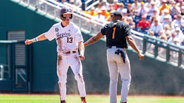 Jun 23, 2024; Omaha, NE, USA; Texas A&M Aggies left fielder Caden Sorrell (13) steals second against Tennessee Volunteers second baseman Christian Moore (1) during the fifth inning at Charles Schwab Field Omaha. Mandatory Credit: Dylan Widger-Imagn Images