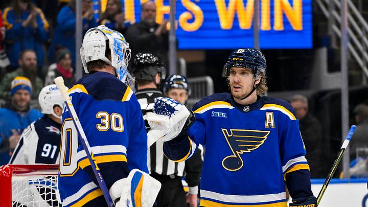 Dec 17, 2025; St. Louis, Missouri, USA; St. Louis Blues center Robert Thomas (18) celebrates with goaltender Joel Hofer (30) after the Blues defeated the Winnipeg Jets at Enterprise Center. Mandatory Credit: Jeff Curry-Imagn Images
