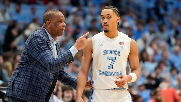 Feb 22, 2025; Chapel Hill, North Carolina, USA; North Carolina Tar Heels head coach Hubert Davis talks to guard Seth Trimble (7) in the first half at Dean E. Smith Center. Mandatory Credit: Bob Donnan-Imagn Images