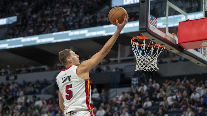 Nov 10, 2024; Minneapolis, Minnesota, USA; Miami Heat forward Nikola Jovic (5) drives to the basket and shoots the ball against the Minnesota Timberwolves in the second half at Target Center. Mandatory Credit: Jesse Johnson-Imagn Images