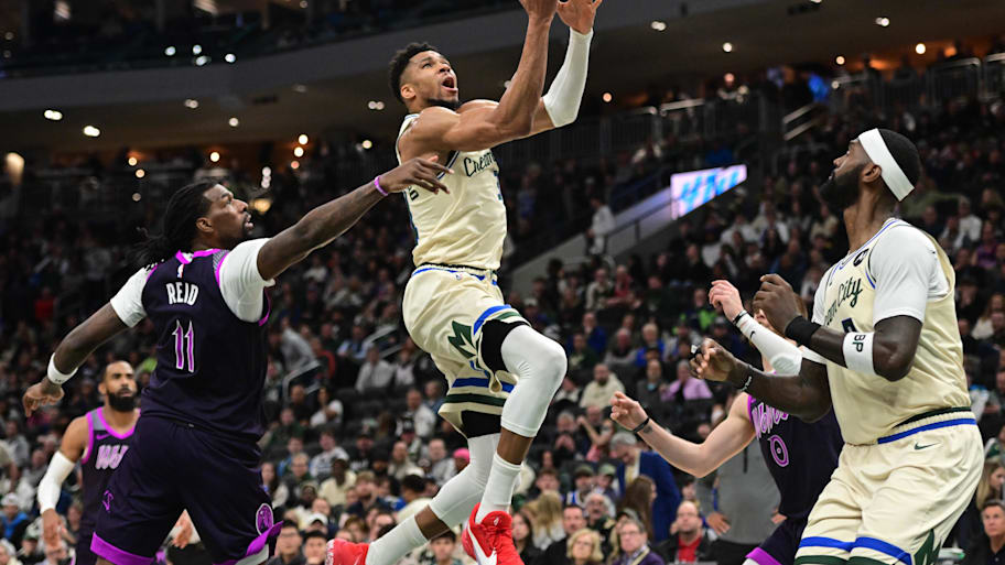 Bucks forward Giannis Antetokounmpo takes a shot against Timberwolves center Naz Reid in a game earlier this season.
