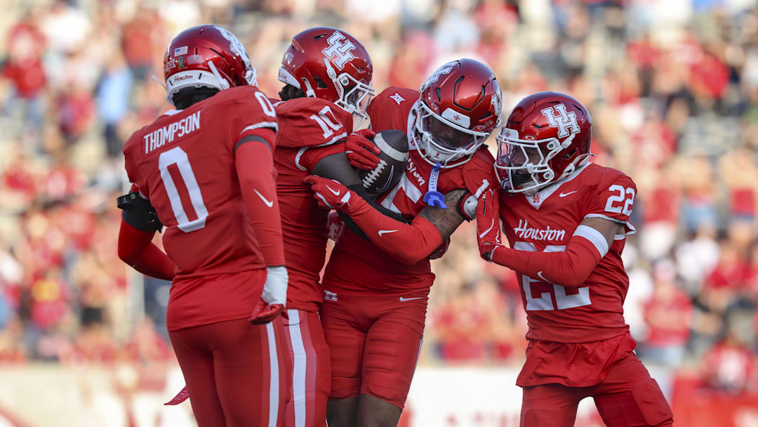 Nov 22, 2025; Houston, Texas, USA; Houston Cougars defensive back Will James (15) celebrates with teammates after an interception during the second quarter against the TCU Horned Frogs at TDECU Stadium. Mandatory Credit: Troy Taormina-Imagn Images