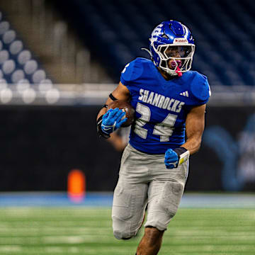 Detroit Catholic Central Jalen Montlouis (24) runs the ball during the Prep Bowl against Detroit King at Ford Field in Detroit on Saturday, Oct. 25, 2025.