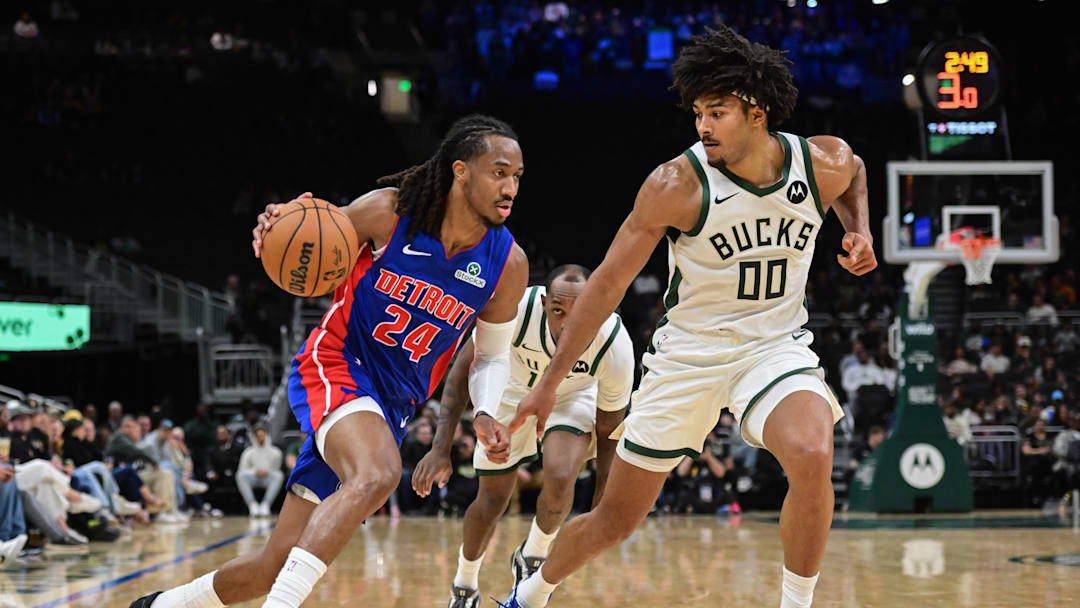 Oct 9, 2025; Milwaukee, Wisconsin, USA; Detroit Pistons guard Daniss Jenkins (24) drives for the basket against Milwaukee Bucks center Jericho Sims (00) in the third quarter at Fiserv Forum. Mandatory Credit: Benny Sieu-Imagn Images