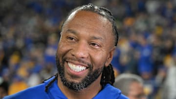 Former Pittsburgh Panthers wide receiver Larry Fitzgerald reacts on the sideline against the Syracuse Orange during the second half at Acrisure Stadium. 