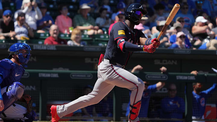 Mar 24, 2025; Mesa, Arizona, USA; Atlanta Braves outfielder Jurickson Profar (7) hits against the Chicago Cubs in the first inning at Sloan Park.