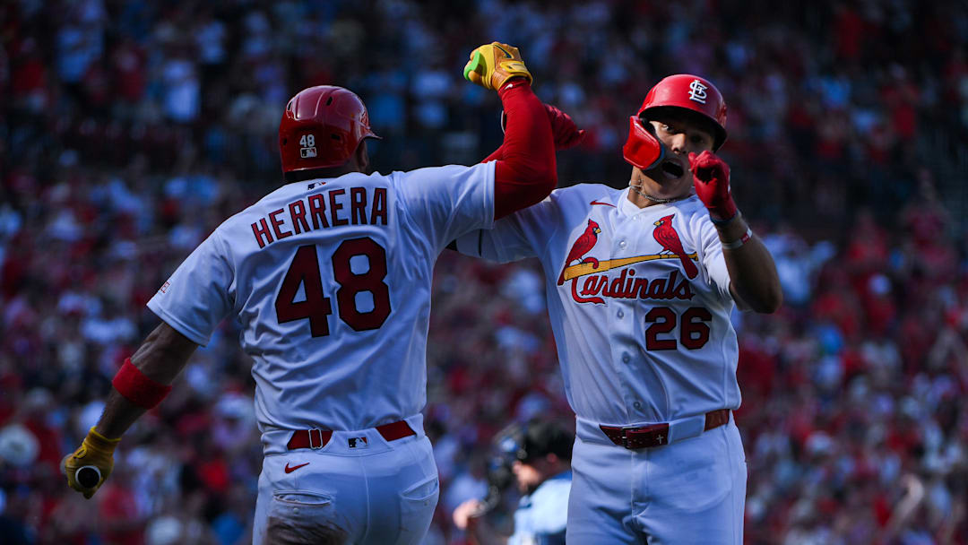 Mar 26, 2026; St. Louis, Missouri, USA; St. Louis Cardinals second baseman JJ Wetherholt (26) celebrates with designated hitter Iván Herrera (48) after hitting a solo home run for his first major league hit during his major league debut in the third inning against the Tampa Bay Rays at Busch Stadium. Mandatory Credit: Jeff Curry-Imagn Images