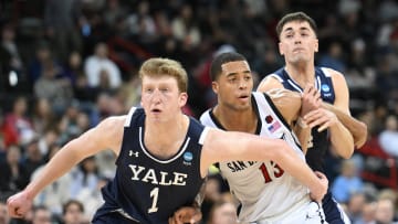 Mar 24, 2024; Spokane, WA, USA; Yale Bulldogs forward Danny Wolf (1) fights San Diego State Aztecs forward Jaedon LeDee (13) for position in the second half at Spokane Veterans Memorial Arena. Mandatory Credit: James Snook-USA TODAY Sports