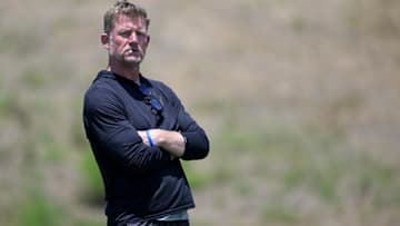May 28, 2024; Thousand Oaks, CA, USA; Les  Snead, General Manager of the Los Angeles Rams, looks on during OTAs at the team training facility at California Lutheran University. Mandatory Credit: Jayne Kamin-Oncea-Imagn Images