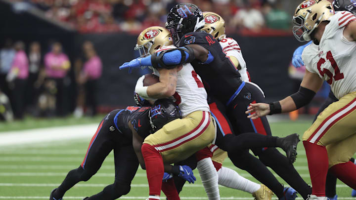 The Houston Texans defense swarms to the ball to stop San Francisco 49ers superstar running back Christian McCaffrey