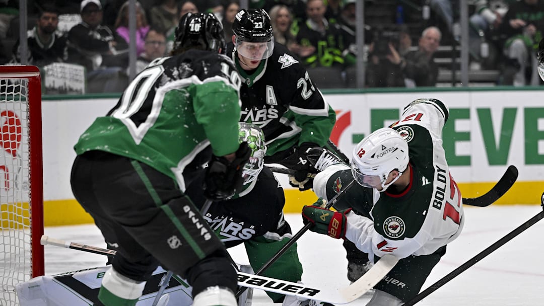 Apr 28, 2026; Dallas, Texas, USA; Minnesota Wild left wing Matt Boldy (12) scores a power play goal against Dallas Stars goaltender Jake Oettinger (29) during the first period in game five of the first round of the 2026 Stanley Cup Playoffs at American Airlines Center. The Stars challenge for goaltender interference and the goal is waved off by the referees. Mandatory Credit: Jerome Miron-Imagn Images