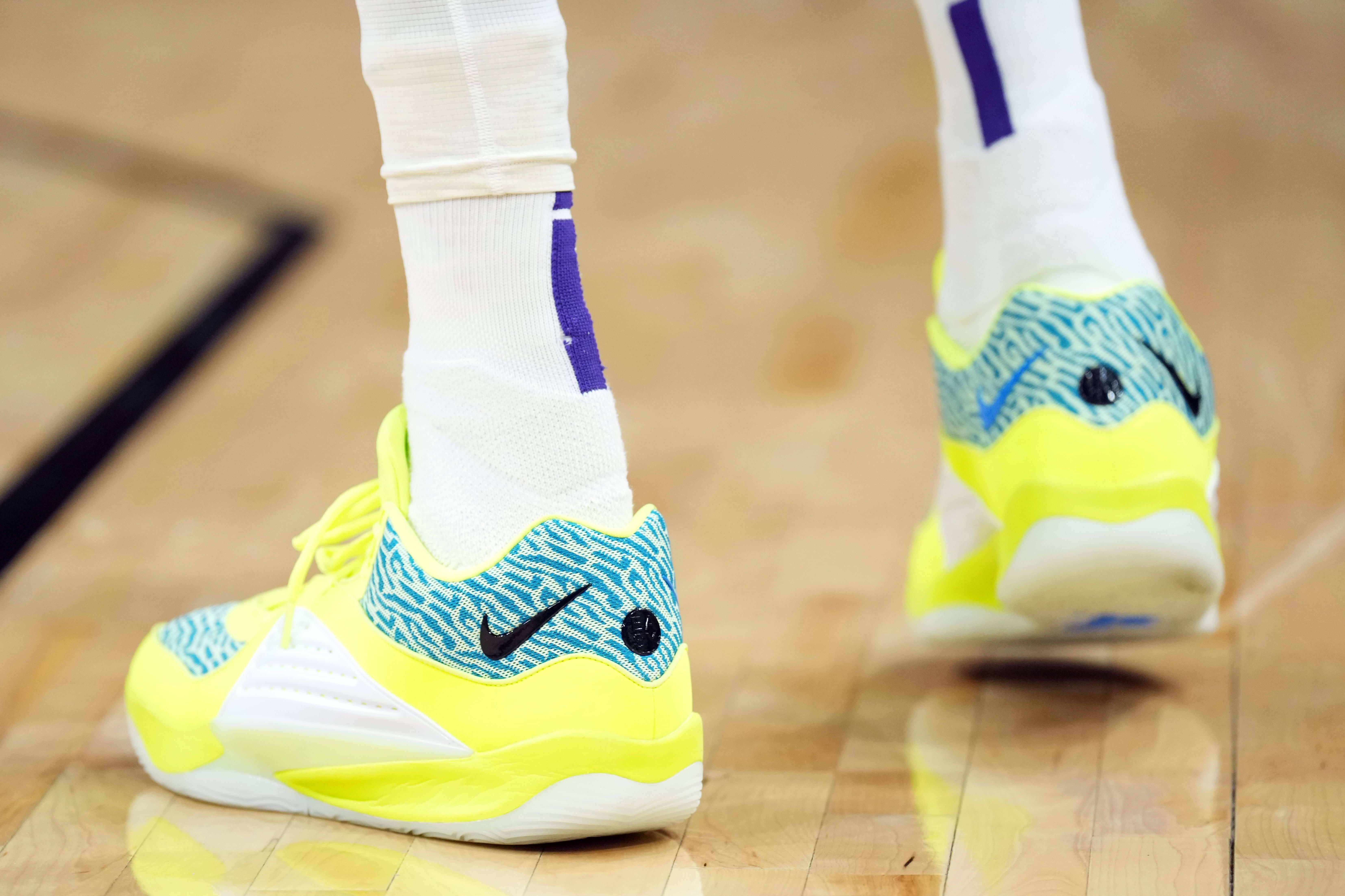 Phoenix Suns forward Kevin Durant's yellow and green Nike sneakers.