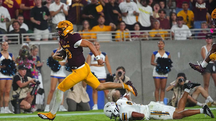 Arizona State quarterback Sam Leavitt (10) runs into the end zone against NAU cornerback Mikale Greer (2) during a game at Mountain America Stadium in Tempe on Aug. 30, 2025. Arizona State quarterback Sam Leavitt (10) runs into the end zone against NAU cornerback Mikale Greer (2) during a game at Mountain America Stadium in Tempe on Aug. 30, 2025.