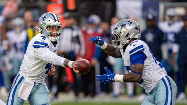 Dallas Cowboys quarterback Dak Prescott passes the ball to running back Ezekiel Elliott.