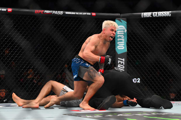 Ricky Simon (red gloves) fights Javid Basharat (blue gloves) in the bantamweight bout during UFC Fight Night.
