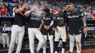 Aug 1, 2025; Miami, Florida, USA;  Miami Marlins center fielder Jakob Marsee (87), left fielder Kyle Stowers (28), third baseman Javier Sanoja (46), second baseman Xavier Edwards (9) and catcher Agustin Ramirez (50) celebrate after winning the game against the New York Yankees at loanDepot Park. Mandatory Credit: Sam Navarro-Imagn Images