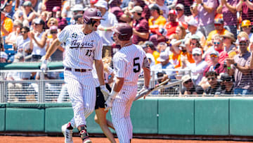 Jun 23, 2024; Omaha, NE, USA; Texas A&M Aggies right fielder Jace Laviolette (17) celebrates with designated hitter Hayden Schott (5) after hitting a home run against the Tennessee Volunteers during the first inning at Charles Schwab Field Omaha. Mandatory Credit: Dylan Widger-USA TODAY Sports