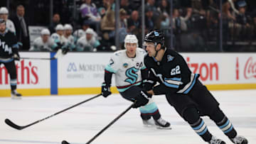 Apr 8, 2025; Salt Lake City, Utah, USA; Utah Hockey Club center Jack McBain (22) skates with the puck against the Seattle Kraken during the third period at Delta Center. Mandatory Credit: Rob Gray-Imagn Images