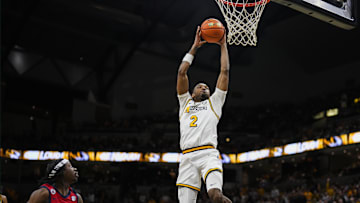 Missouri Tigers guard Tamar Bates (2) dunks the ball in a game versus the Ole Miss Rebels this season.