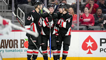 Buffalo Sabres players Josh Norris, Zach Benson and Bowen Byram