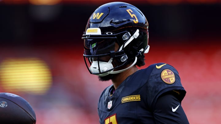 Aug 25, 2024; Landover, Maryland, USA; Washington Commanders quarterback Jayden Daniels (5) warms up before playing a preseason game against the New England Patriots at Commanders Field. Mandatory Credit: Peter Casey-USA TODAY Sports