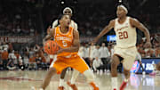 Jan 11, 2025; Austin, Texas, USA; Tennessee Volunteers guard Zakai Zeigler (5) drives to the basket against Texas Longhorns guard Tre Johnson (20) during the second half at Moody Center. Mandatory Credit: Scott Wachter-Imagn Images