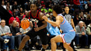 Cincinnati Bearcats guard Jizzle James (2) drives on a Dayton Flyers defender in the second half of the NCAA men's basketball game between the Dayton Flyers and Cincinnati Bearcats at Heritage Bank Center in Cincinnati on Saturday, Dec. 16, 2023.